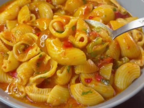 Creamy one-pan shell pasta with peppers and melted mozzarella in a skillet