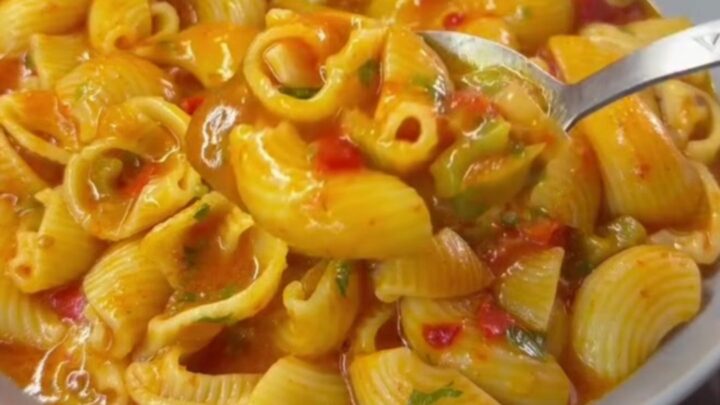 Creamy one-pan shell pasta with peppers and melted mozzarella in a skillet