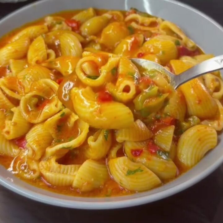 Creamy one-pan shell pasta with peppers and melted mozzarella in a skillet