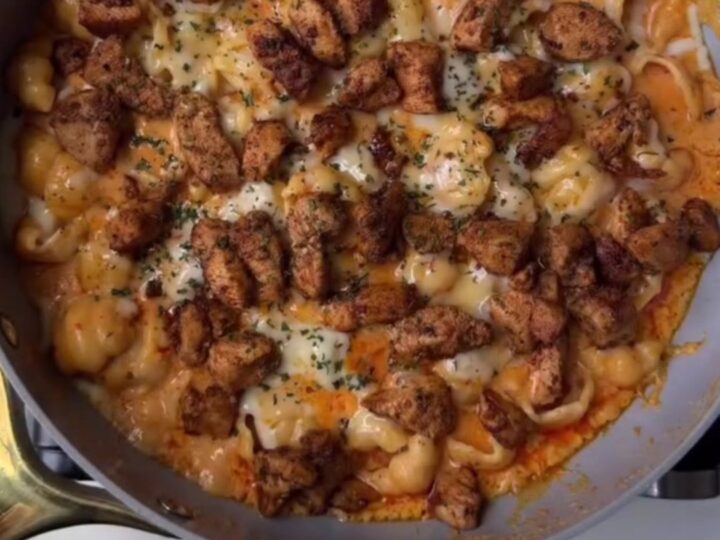 Spicy chili chicken penne in a creamy parmesan sauce, garnished with fresh parsley and chili flakes