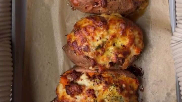 Loaded sweet potato skins with spiced beef and melted cheddar, garnished with cilantro and sour cream