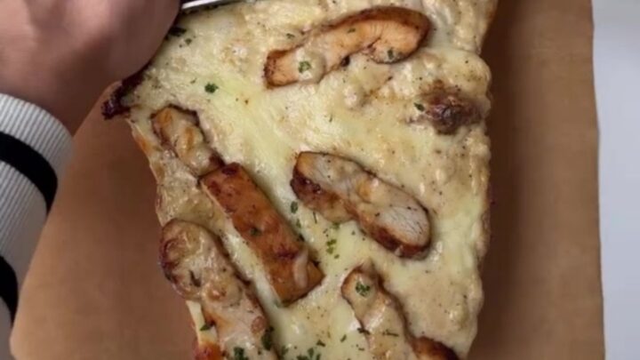 Crispy chicken Alfredo bake with blistered mozzarella and stringy cheese pull