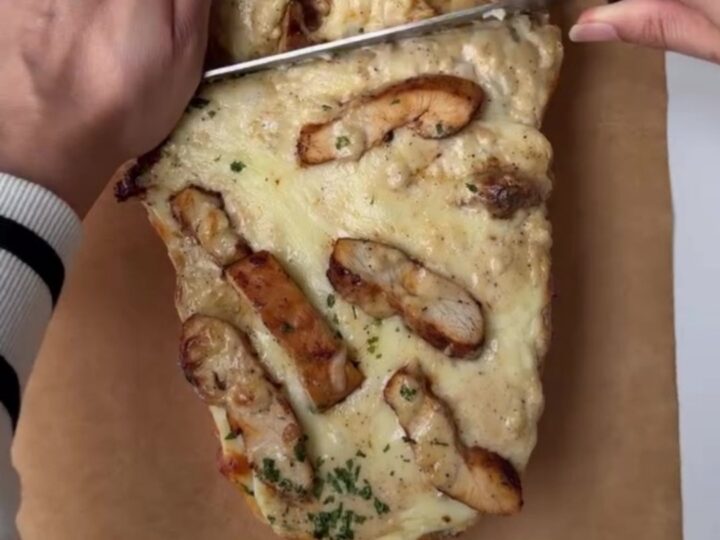 Crispy chicken Alfredo bake with blistered mozzarella and stringy cheese pull