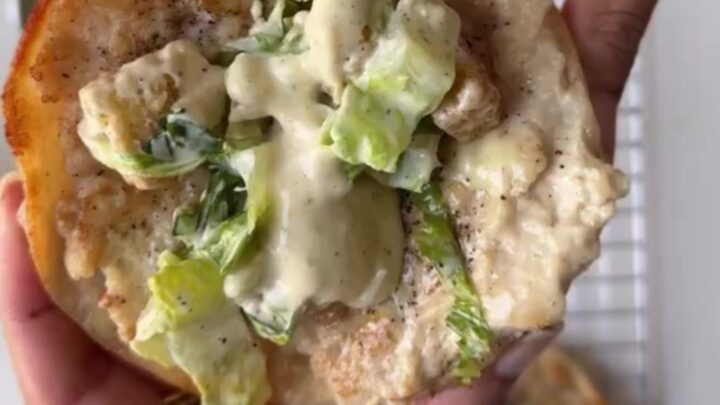 Crispy chicken taco topped with romaine, parmesan, and Caesar dressing