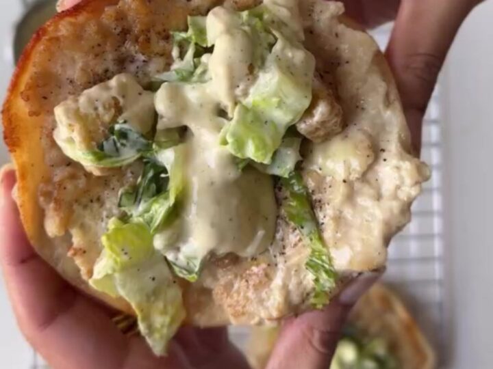 Crispy chicken taco topped with romaine, parmesan, and Caesar dressing