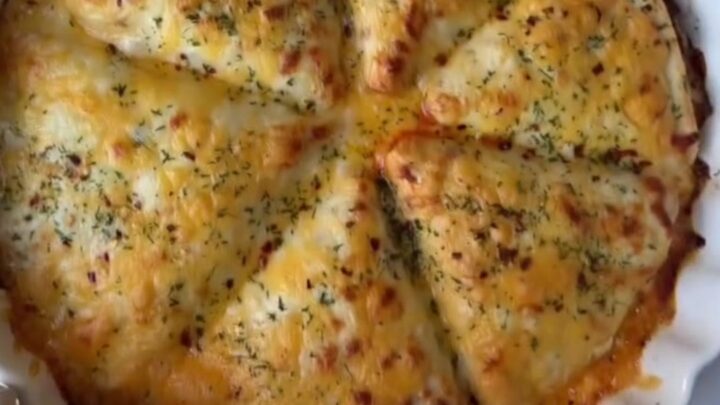 Golden hot pocket broken open showing gooey cheese pull and savory beef filling