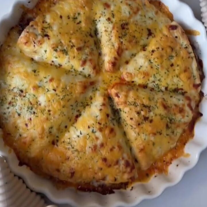 Golden hot pocket broken open showing gooey cheese pull and savory beef filling