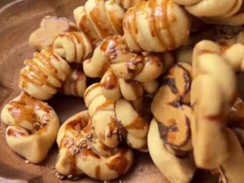 Savory Turkish cookies with sesame seeds on a baking sheet