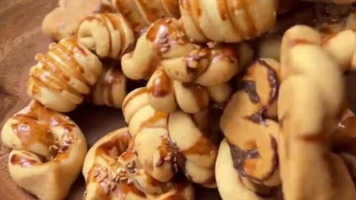 Savory Turkish cookies with sesame seeds on a baking sheet