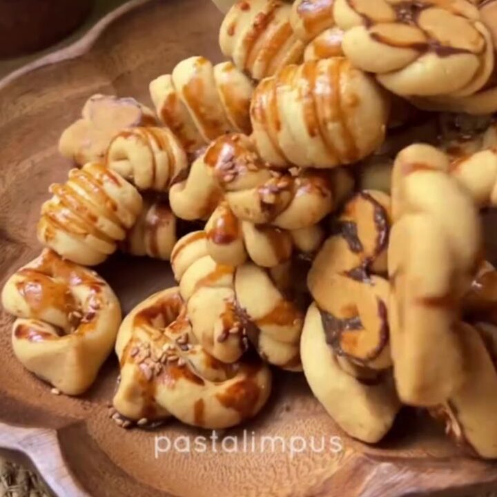 Savory Turkish cookies with sesame seeds on a baking sheet