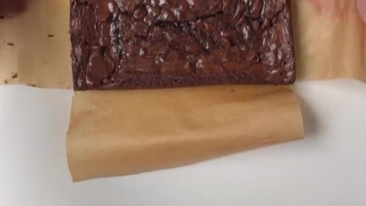 Sliced crinkle-top fudgy brownie showing crackly top and moist center