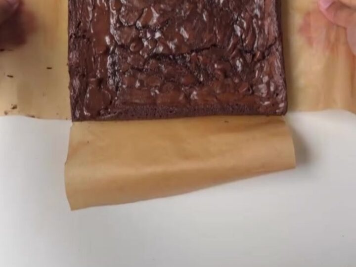 Sliced crinkle-top fudgy brownie showing crackly top and moist center