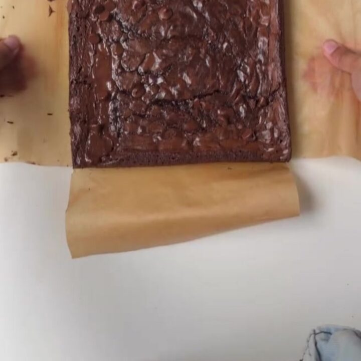 Sliced crinkle-top fudgy brownie showing crackly top and moist center