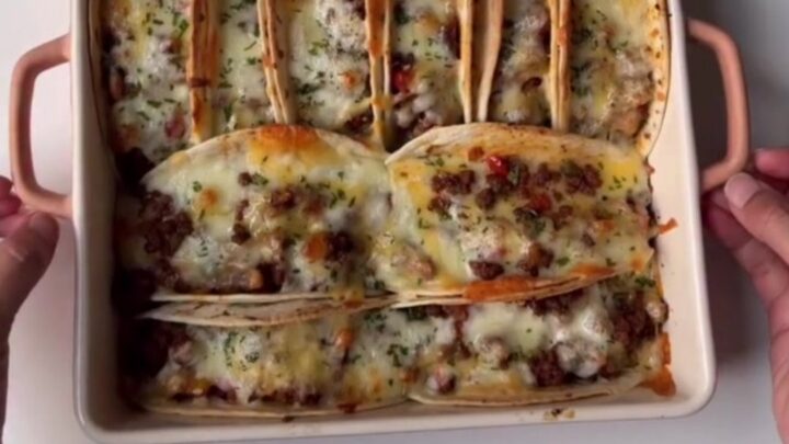 Baked chipotle beef tacos with melted cheese and chipotle crema