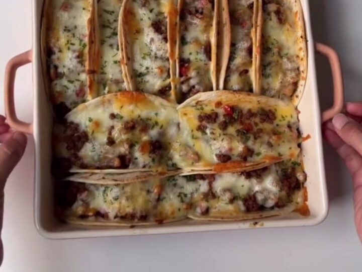 Baked chipotle beef tacos with melted cheese and chipotle crema