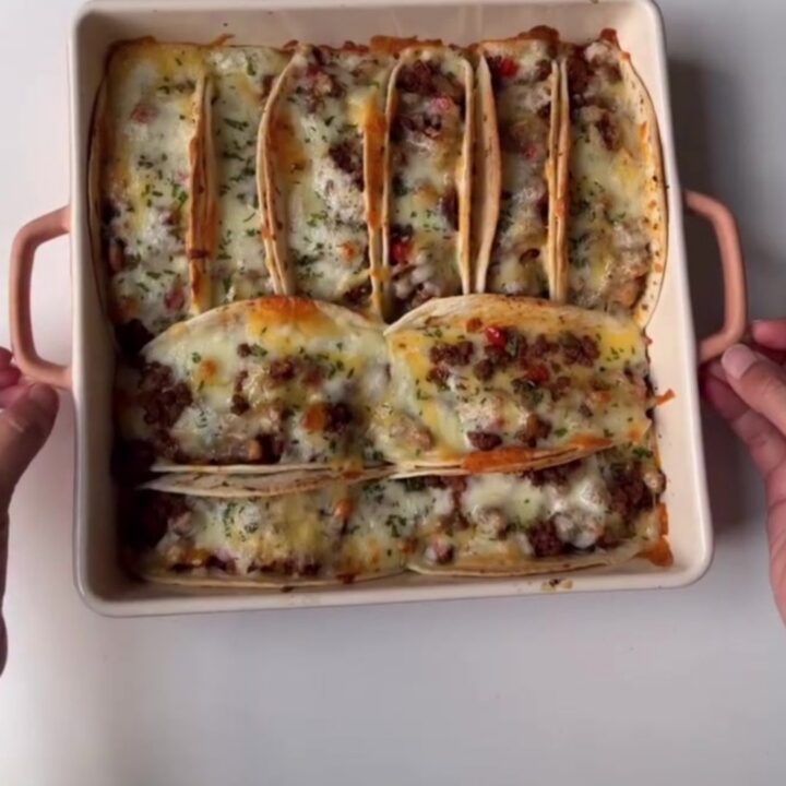 Baked chipotle beef tacos with melted cheese and chipotle crema