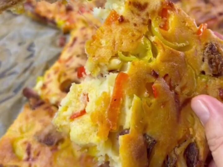 Golden puffy crepe pizza squares with melted mozzarella being pulled apart