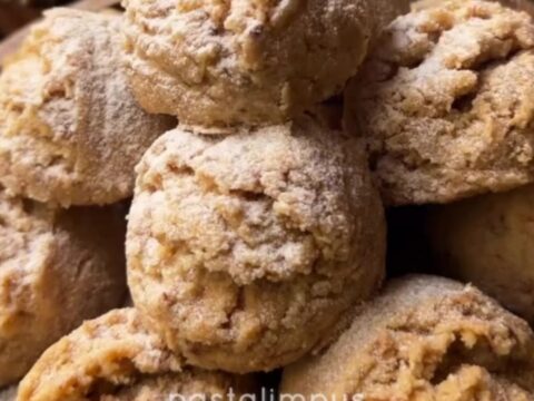 Tahini walnut cookies broken in half showing crumbly halva texture