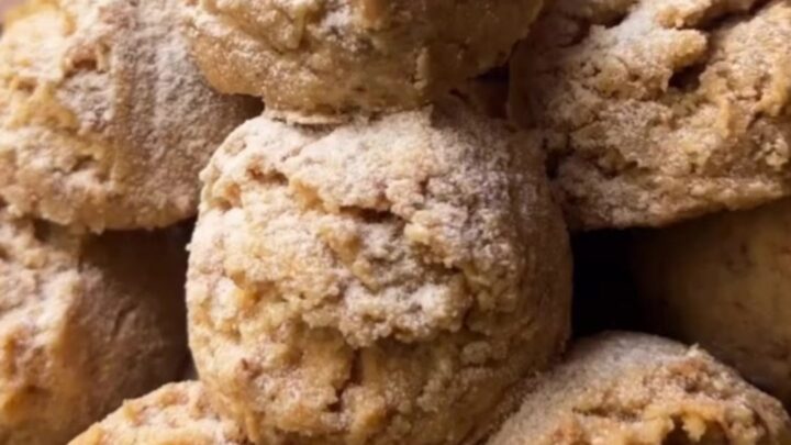Tahini walnut cookies broken in half showing crumbly halva texture