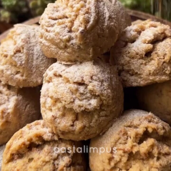 Tahini walnut cookies broken in half showing crumbly halva texture