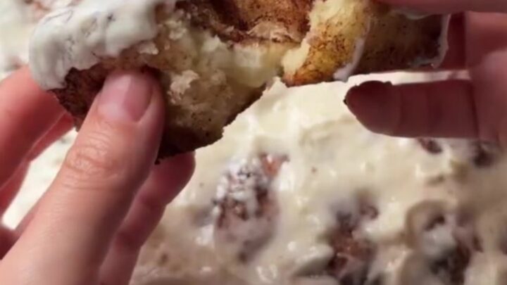 Pull-apart cinnamon monkey bread rolls with gooey glaze in a baking dish