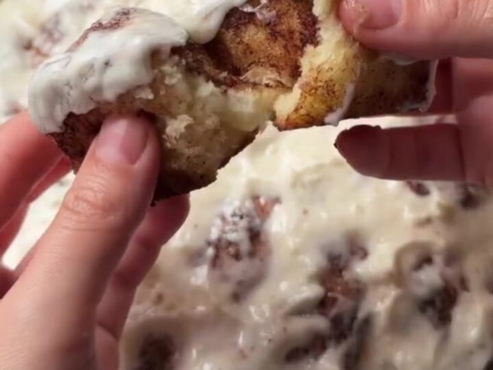 Pull-apart cinnamon monkey bread rolls with gooey glaze in a baking dish