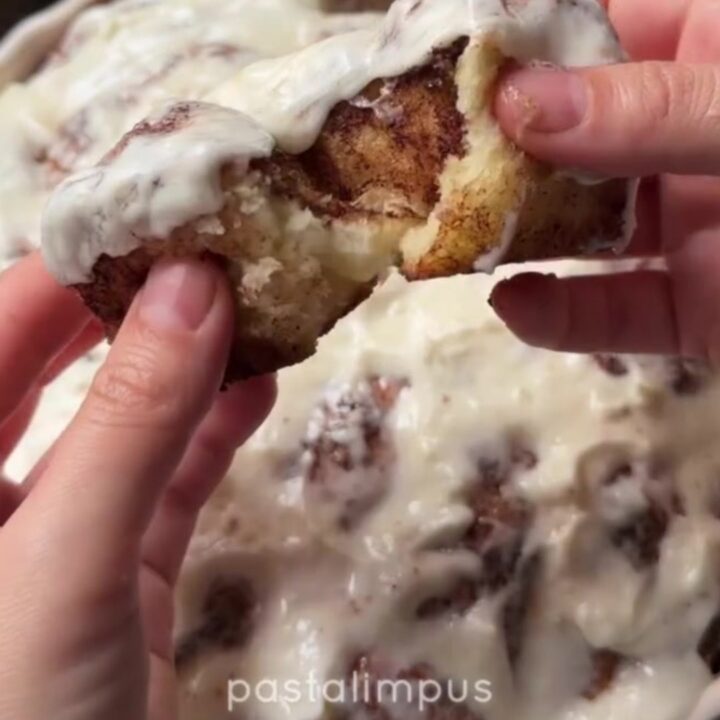 Pull-apart cinnamon monkey bread rolls with gooey glaze in a baking dish