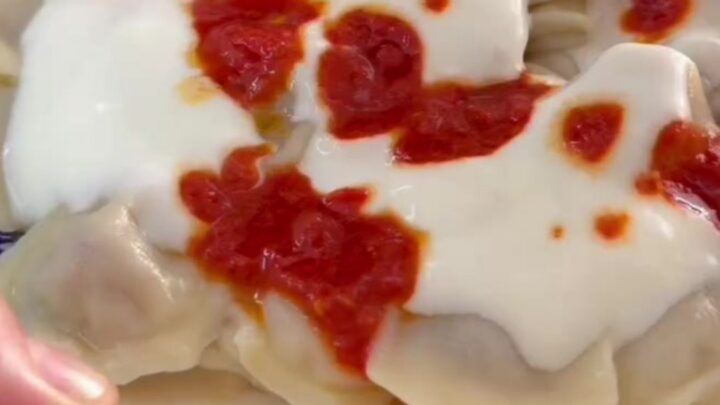 Honeycomb manti dumplings topped with garlic yogurt and drizzled with red paprika butter