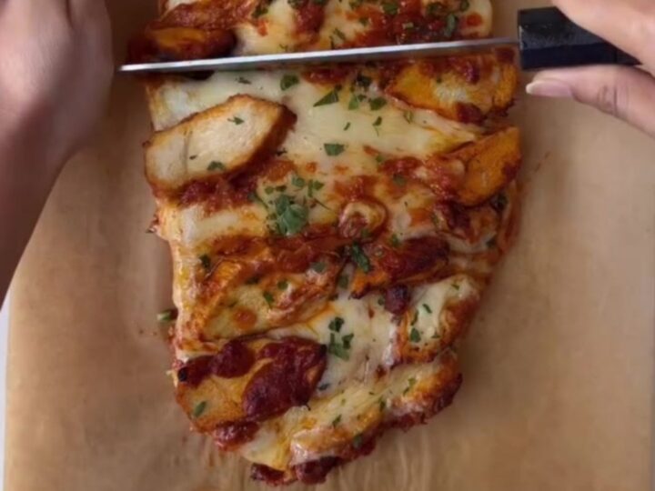 Sliced butter chicken cheesy bread bake with melted mozzarella and creamy sauce