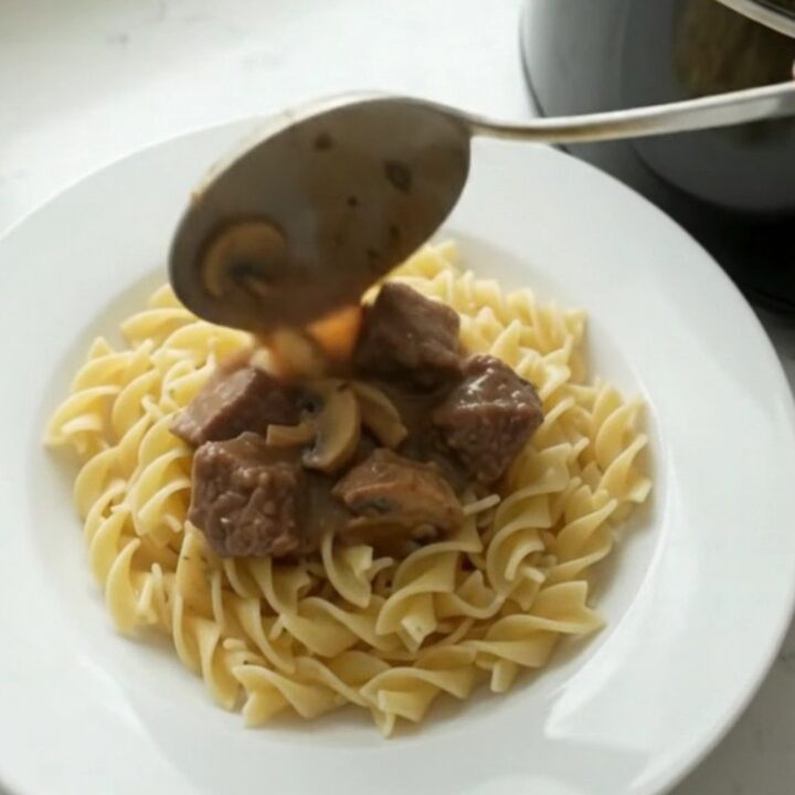 Creamy beef stroganoff in a slow cooker, with tender beef and mushrooms in a rich sauce