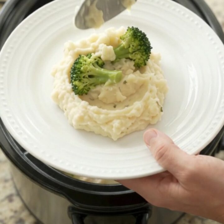Creamy Swiss broccoli chicken in a slow cooker, with melted cheese and tender chicken pieces.