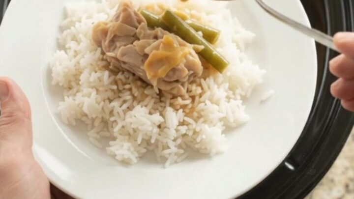 Slow cooker chicken thighs with green beans in a creamy cheddar sauce