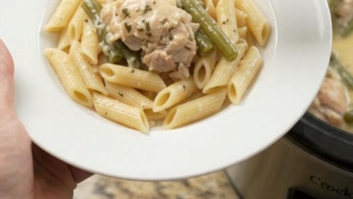 Slow cooker creamy mozzarella green bean chicken thighs in a bubbling sauce
