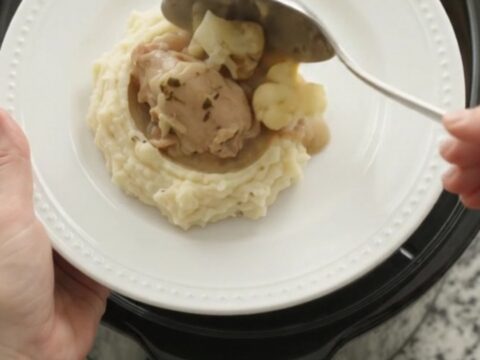 Slow cooker chicken thighs and cauliflower in a creamy Swiss cheese sauce