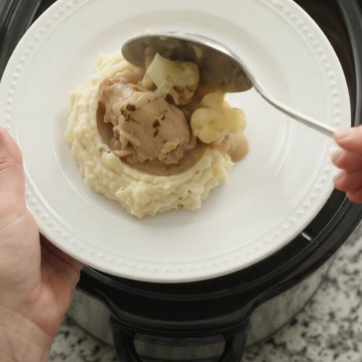 Slow cooker chicken thighs and cauliflower in a creamy Swiss cheese sauce