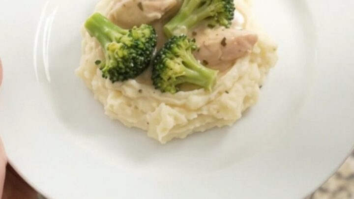 Slow cooker filled with creamy Swiss chicken and broccoli