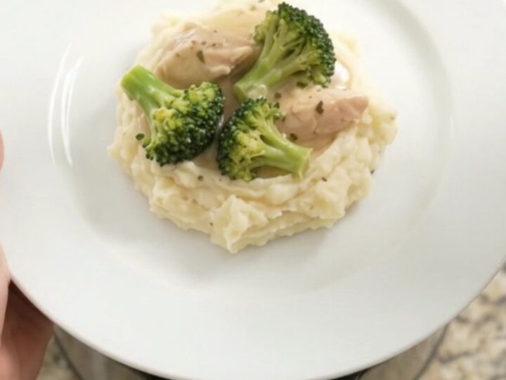 Slow cooker filled with creamy Swiss chicken and broccoli