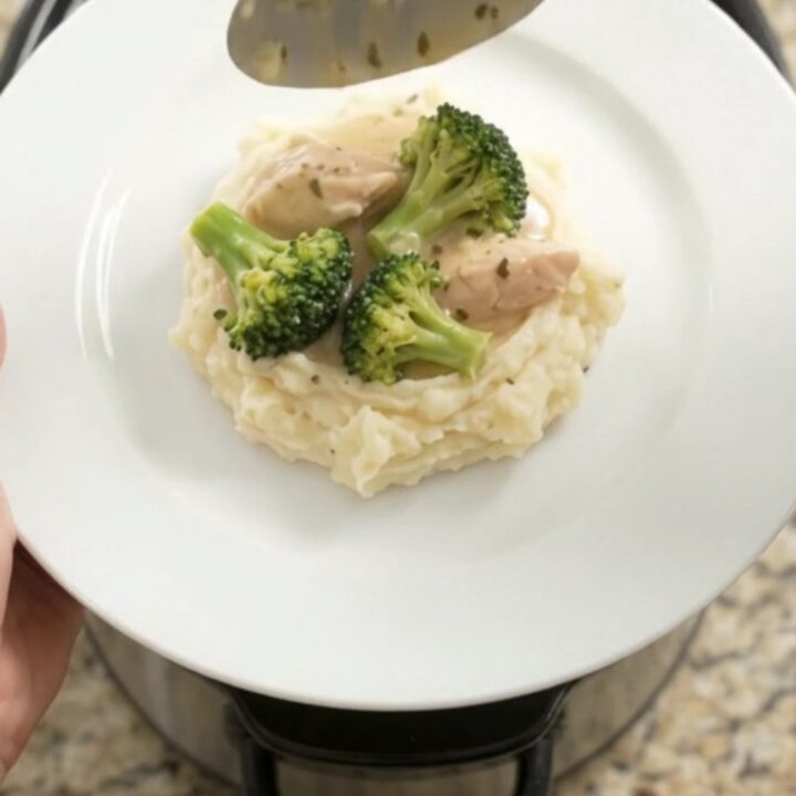 Slow cooker filled with creamy Swiss chicken and broccoli