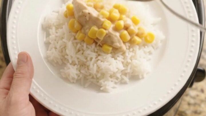 Golden cheddar sweet corn chicken tenders in a slow cooker, creamy and bubbling.