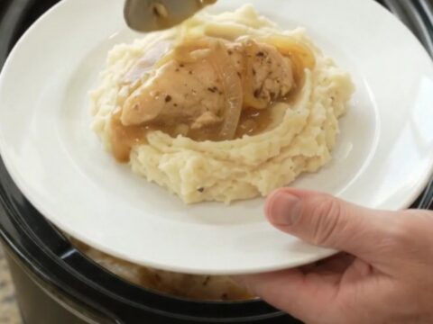 Golden Swiss French Onion Chicken Tenders in a slow cooker, creamy sauce with melted cheese and onions