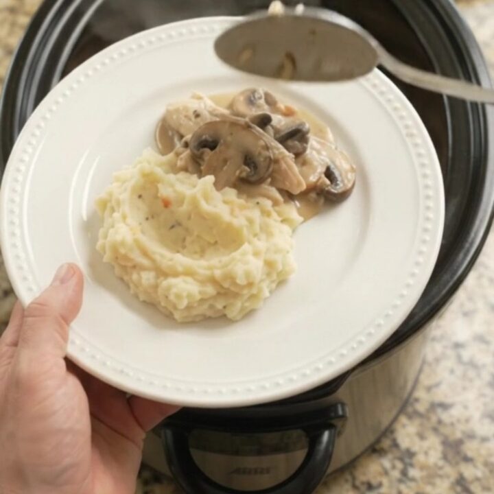 Creamy Swiss mushroom turkey breast in a slow cooker, with melted cheese and sauce