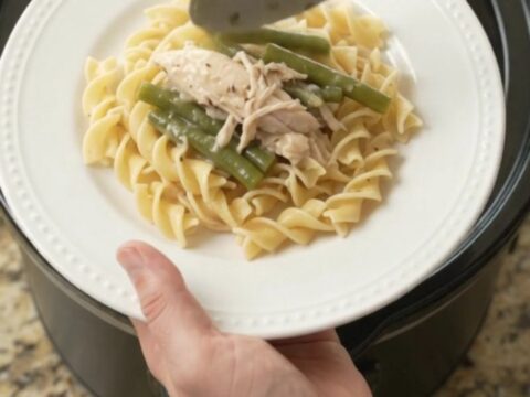 Slow cooker with creamy turkey and green beans in a rich Parmesan sauce