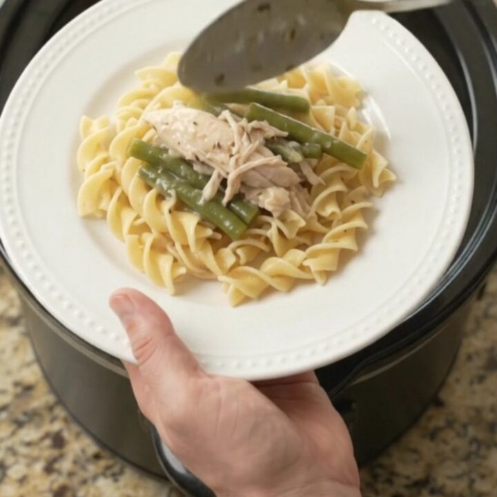 Slow cooker with creamy turkey and green beans in a rich Parmesan sauce