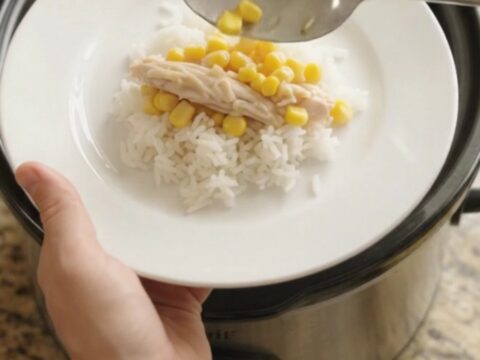 Shredded turkey and sweet corn in creamy cheddar sauce in a slow cooker