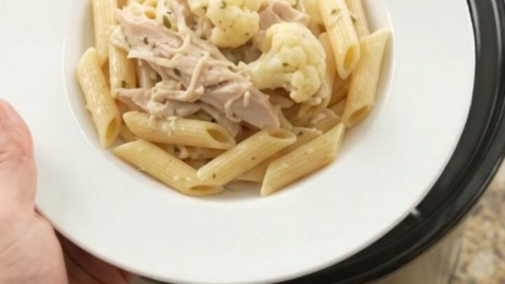 Slow cooker turkey breast with cauliflower and melted mozzarella in a creamy sauce