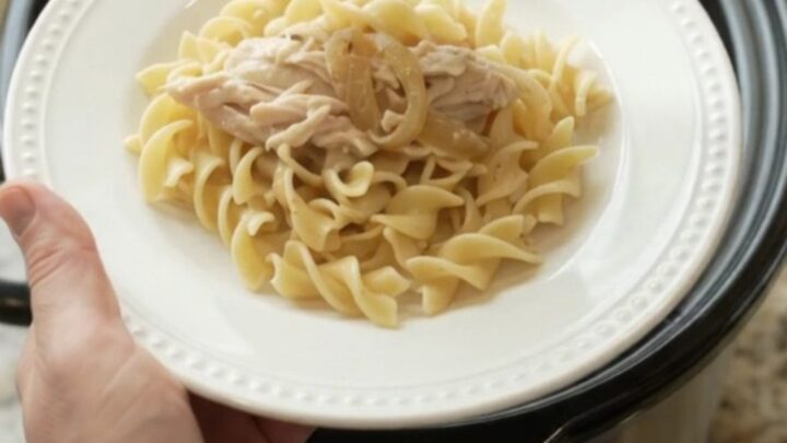 Slow cooker turkey breast with creamy French onion sauce, topped with melted cheese and onions.