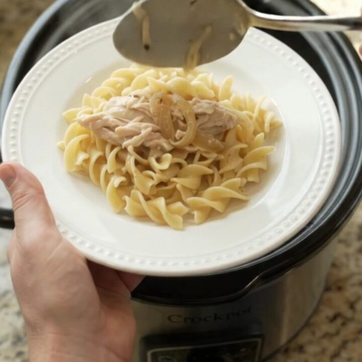 Slow cooker turkey breast with creamy French onion sauce, topped with melted cheese and onions.