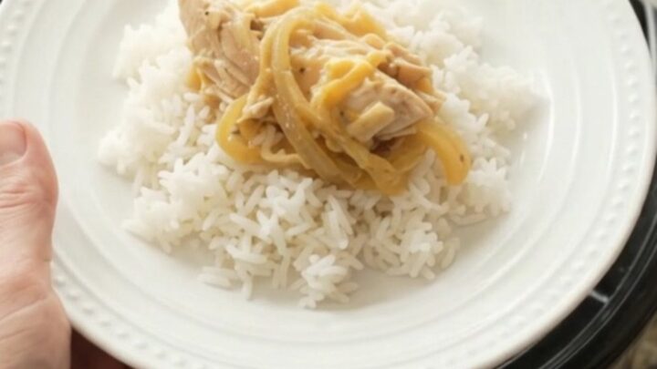 Shredded turkey breast in creamy cheddar sauce with caramelized onions in a slow cooker