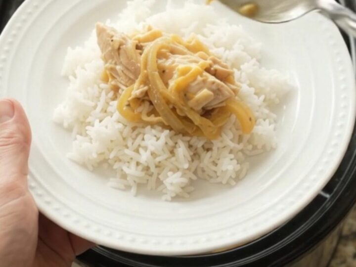 Shredded turkey breast in creamy cheddar sauce with caramelized onions in a slow cooker