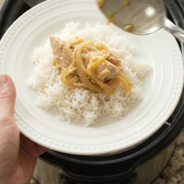 Shredded turkey breast in creamy cheddar sauce with caramelized onions in a slow cooker